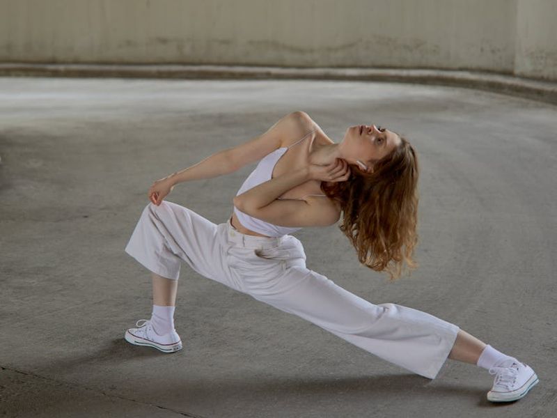 Person performing a fluid yoga stretching movement.